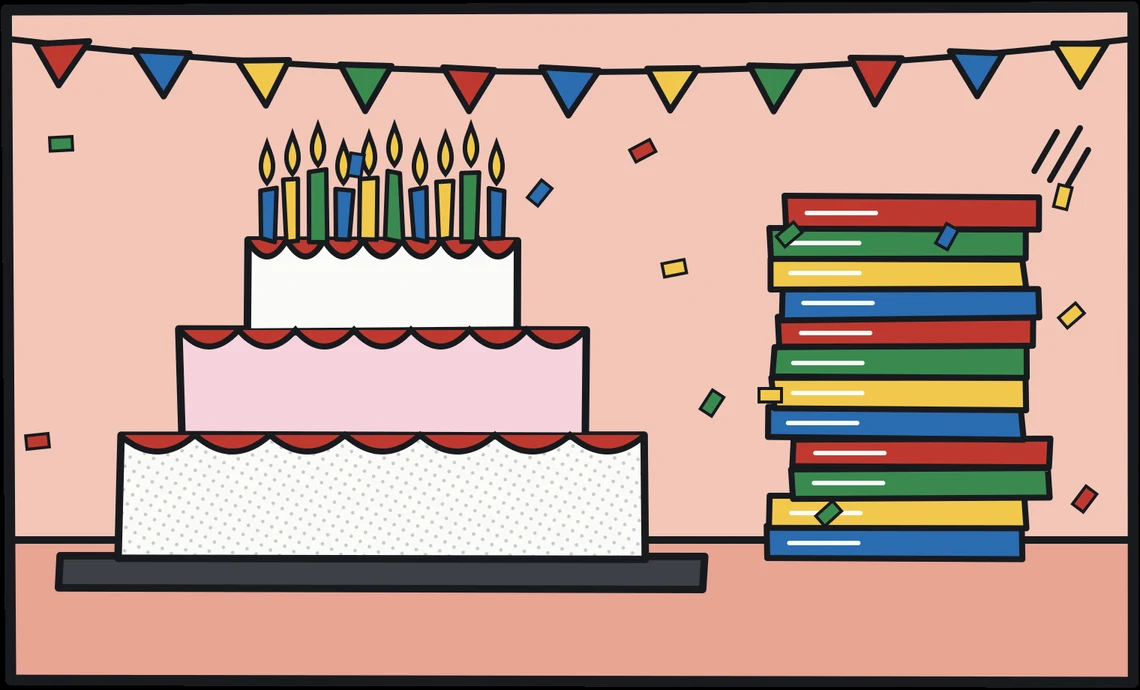 A three-tier birthday cake full of candles beside a tall tower of printed albums, under bunting and confetti.